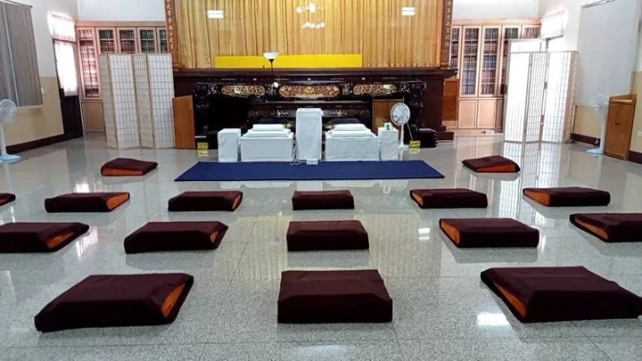 Rows of meditation cushions inside the Guanyin Temple hall.